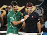 Serbia's Novak Djokovic pats Switzerland's Roger Federer after their match on January 30, 2020