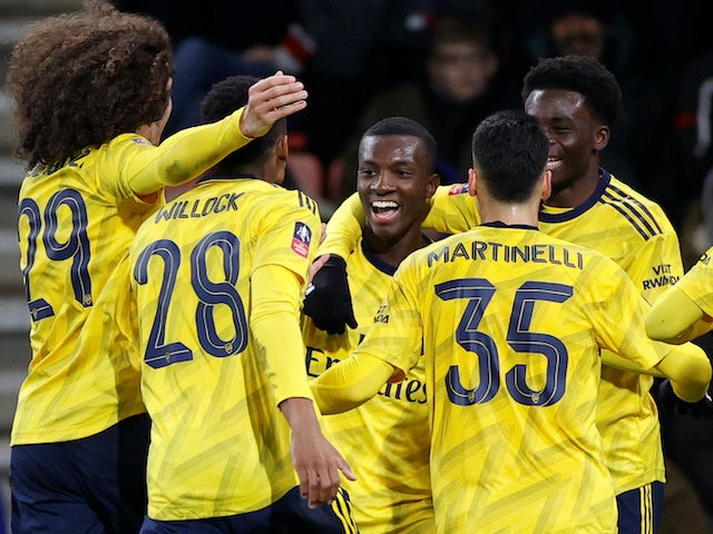 Eddie Nketiah celebrates scoring his side's second with Arsenal teammates on January 27, 2020