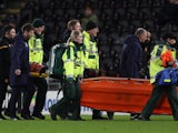 Huddersfield's Kamil Grabara is stretchered off after sustaining an injury on January 28, 2020
