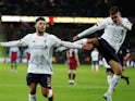 Liverpool's Alex Oxlade-Chamberlain celebrates scoring their second goal with Roberto Firmino on January 29, 2020