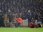 Liverpool's Sadio Mane goes down after sustaining an injury as Liverpool manager Jurgen Klopp reacts on the sideline in January 2020