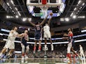 Milwaukee Bucks forward Khris Middleton (22) shoots against Washington Wizards center Thomas Bryant (13) during the fourth quarter at Fiserv Forum on January 29, 2020