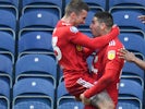 Fulham's Aleksandar Mitrovic celebrates with Joe Bryan after scoring on February 8, 2020