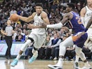 Milwaukee Bucks forward Giannis Antetokounmpo (34) drives past Phoenix Suns center Deandre Ayton (22) in the fourth quarter at Fiserv Forum on February 2, 2020