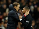 Paris St Germain's Kylian Mbappe speaks to coach Thomas Tuchel as he comes off as a substitute in February 2020