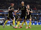 Brentford's Ethan Pinnock celebrates scoring their first goal with teammates on February 15, 2020