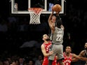 Brooklyn Nets guard Caris LeVert (22) shoots over Toronto Raptors guard Fred VanVleet (23) during the first half at Barclays Center on February 13, 2020