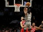 Brooklyn Nets guard Caris LeVert (22) shoots over Toronto Raptors guard Fred VanVleet (23) during the first half at Barclays Center on February 13, 2020
