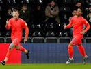 Huddersfield Town's Harry Toffolo celebrates scoring their first goal with Chris Willock on February 15, 2020