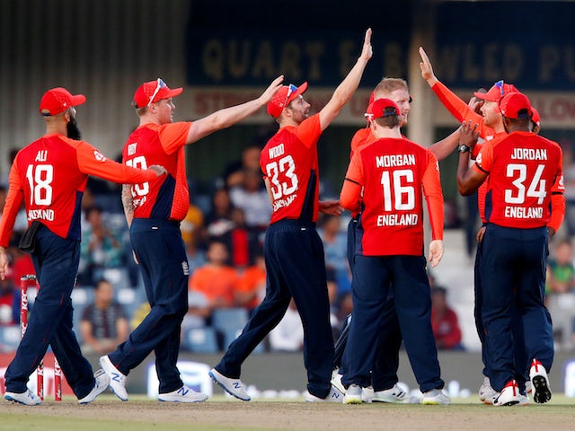 England's Ben Stokes celebrates the wicket of South Africa's Rassie van der Dussen with teammates on February 12, 2020