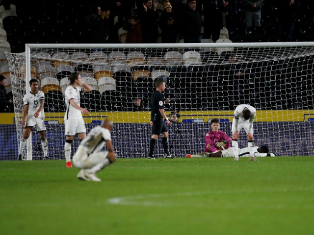 Swansea City's players look dejected after conceding a fourth goal in their 4-4 draw with Hull City on February 14, 2020