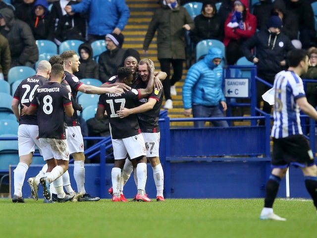Reading's George Puscas celebrates scoring their second goal with teammates on February 15, 2020