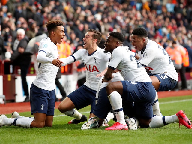 Tottenham Hotspur's Son Heung-min celebrates scoring their third goal with Gedson Fernandes and teammates on February 16, 2020
