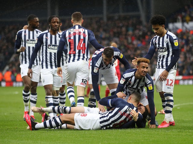 West Bromwich Albion players celebrate after Nottingham Forest's Tobias Figueiredo scored an own goal and their second goal on February 15, 2020