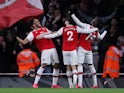 Arsenal's Pierre-Emerick Aubameyang celebrates scoring their third goal with Nicolas Pepe and Hector Bellerin on February 23, 2020