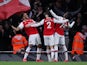 Arsenal's Pierre-Emerick Aubameyang celebrates scoring their third goal with Nicolas Pepe and Hector Bellerin on February 23, 2020