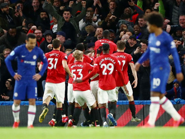 Harry Maguire is mobbed after scoring Manchester United's second goal against Chelsea on February 17, 2020
