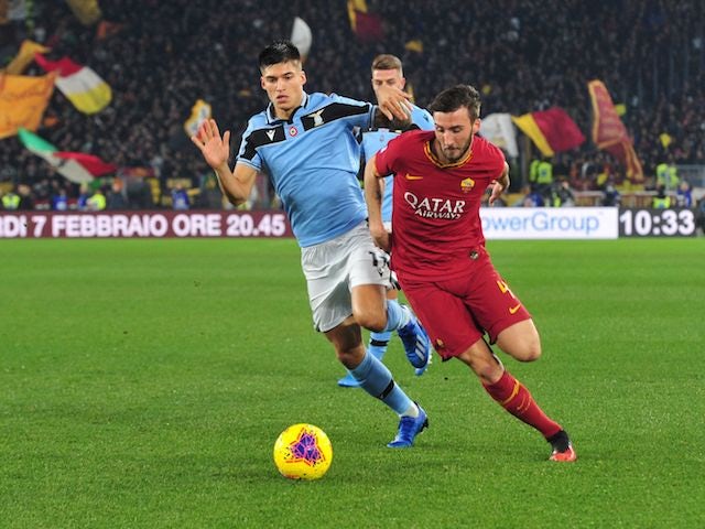 Lazio's Joaquin Correa in action with AS Roma's Bryan Cristante in Serie A on January 26, 2020