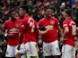 Manchester United's Anthony Martial celebrates scoring their second goal with Bruno Fernandes and teammates on February 23, 2020