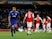 Olympiacos' Youssef El-Arabi celebrates scoring their second goal as Arsenal players look dejected on February 27, 2020