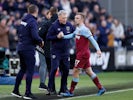 West Ham United's Jarrod Bowen shakes hands with manager David Moyes after being substituted off on February 29, 2020