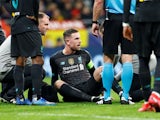 Liverpool's Jordan Henderson receives medical attention after sustaining an injury on February 18, 2020