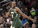 Milwaukee Bucks forward Khris Middleton (22) reacts after making a three point shot during the second half Washington Wizards at Capital One Arena on February 25, 2020