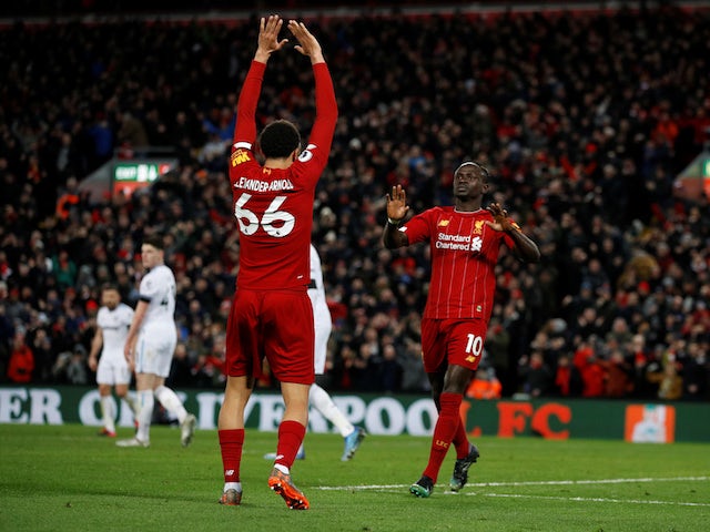 Liverpool's Sadio Mane celebrates scoring their third goal with Trent Alexander-Arnold on February 24, 2020
