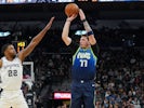 Dallas Mavericks guard Luka Doncic (77) shoots over San Antonio Spurs forward Rudy Gay (22) in the second half at the AT&T Center on February 27, 2020