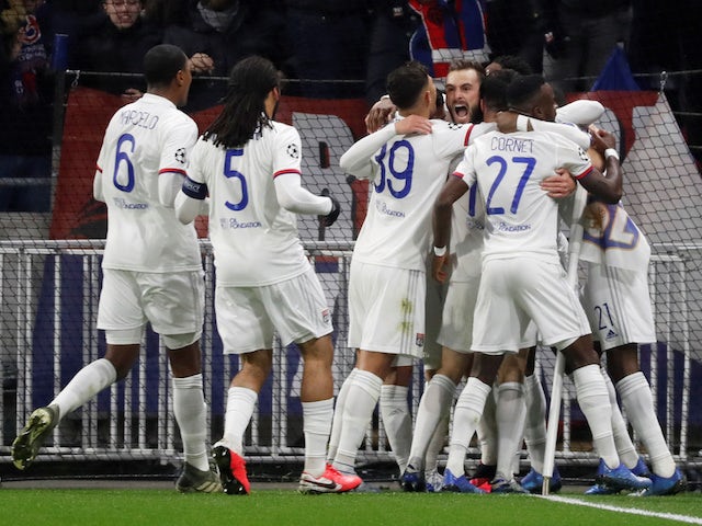 Lyon's Lucas Tousart celebrates scoring their first goal with teammates on February 26, 2020