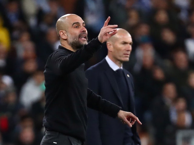 Manchester City manager Pep Guardiola reacts alongside Real Madrid coach Zinedine Zidane on February 26, 2020