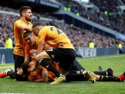 Wolverhampton Wanderers' Raul Jimenez celebrates scoring their third goal with Diogo Jota, Conor Coady, Romain Saiss and Ruben Neves on March 1, 2020