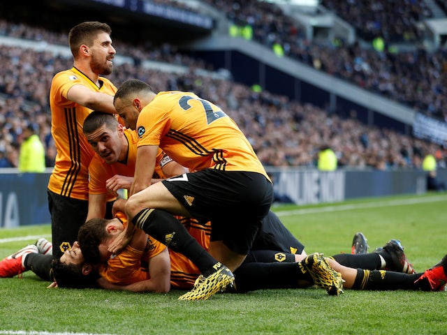 Wolverhampton Wanderers' Raul Jimenez celebrates scoring their third goal with Diogo Jota, Conor Coady, Romain Saiss and Ruben Neves on March 1, 2020