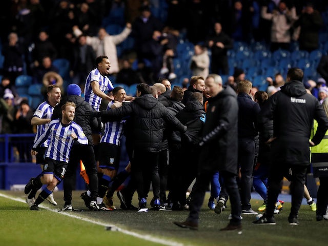 Sheffield Wednesday's Steven Fletcher celebrates with teammates after scoring their first goal on February 26, 2020