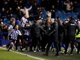 Sheffield Wednesday's Steven Fletcher celebrates with teammates after scoring their first goal on February 26, 2020
