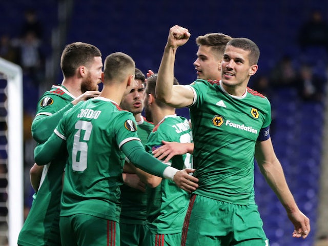 Wolverhampton Wanderers' Matt Doherty celebrates scoring their second goal with Conor Coady and teammates on February 27, 2020
