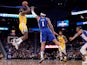 Golden State Warriors forward Eric Paschall (7) shoots the ball over Philadelphia 76ers forward Mike Scott (1) in the fourth quarter at the Chase Center on March 8, 2020
