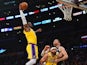  Los Angeles Lakers forward LeBron James (23) moves in for a dunk as center JaVale McGee (7) provides coverage against Milwaukee Bucks center Brook Lopez (11) during the first half at Staples Center on March 7, 2020