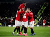 Manchester United's Odion Ighalo celebrates scoring their third goal with Manchester United's Fred and teammates on March 5, 2020
