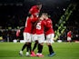 Manchester United's Odion Ighalo celebrates scoring their third goal with Manchester United's Fred and teammates on March 5, 2020