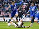 Wigan Athletic's Leon Balogun in action with Luton Town's James Collins on March 7, 2020