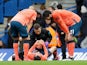 Everton's Andre Gomes and Richarlison look on as Bernard receives medical attention after sustaining an injury in March 2020