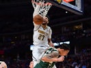 Denver Nuggets guard Jamal Murray (27) finishes off a basket over Milwaukee Bucks forward D.J. Wilson (5) in the third quarter at the Pepsi Center on March 10, 2020