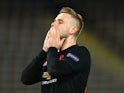 Manchester United's Luke Shaw reacts on March 12, 2020