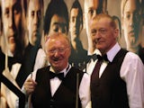 Dennis Taylor and Steve Davis (R) are presented to the audience during the afternoon session in April 2010
