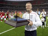 David Beckham celebrates winning his 100th cap for England in 2008