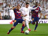 Real Madrid midfielder Federico Valverde in action with Barcelona's Jordi Alba on March 1, 2020