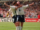 Paul Gascoigne celebrates with Teddy Sheringham after scoring for England against Scotland at Euro 96