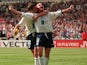 Paul Gascoigne celebrates with Teddy Sheringham after scoring for England against Scotland at Euro 96