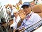 Former Formula One driver Nelson Piquet of Brazil (R) and Formula One supremo Bernie Ecclestone arrive at the drivers parade before the Hungarian F1 Grand Prix at the Hungaroring circuit, near Budapest, Hungary July 26, 2015